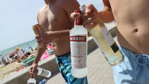 Tourists with alcohol on beach in Palma, 26 Jul 17