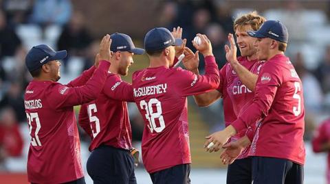 Northants bowler David Willey celebrates with team mates after taking the wicket of Graham Clark off the first ball of the innings during the Vitality Blast match between Durham and Northamptonshire Steelbacks at Banks Homes Riverside