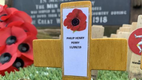 Wooden cross with Private Perry's name on it