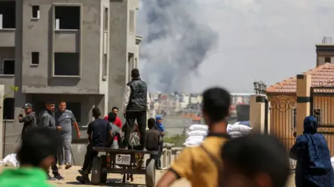 Smoke rises following an Israeli strike after the Israeli military began evacuating Palestinian civilians ahead of a threatened assault on Rafah, amid the ongoing conflict between Israel and Hamas, in Rafah, in the southern Gaza Strip