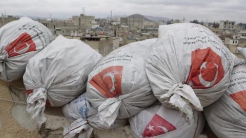 Sandbags bearing Turkish flags on a rooftop in Azaz, northern Syria