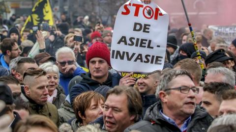 Protesters take part in the "March Against Marrakech" demonstration near European institutions headquarters in Brussels, Belgium, 16 December 2018