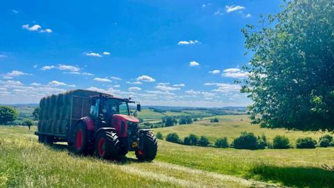 Farmer's tractor in field