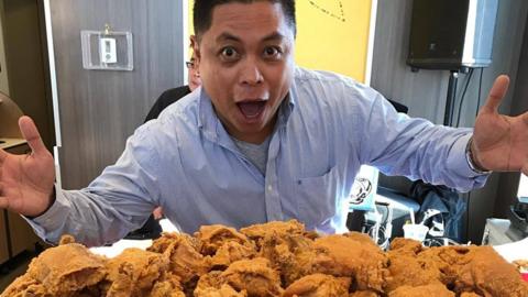 Winnipegger Ron Cantiveros with an oversized bucket of Jollibee fried chicken