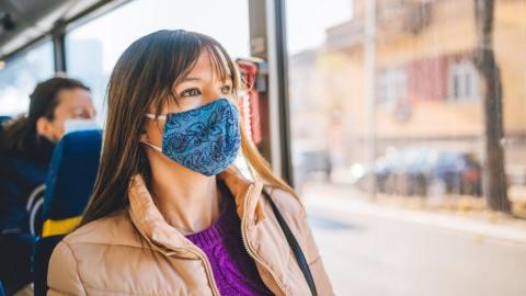 Passenger wearing mask on bus