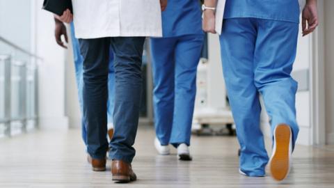 healthcare workers'' feet as they walk