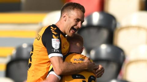 Ryan Taylor (29) of Newport County celebrates scoring his side's second goal with Mickey Demetriou