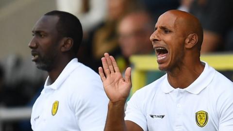 Dino Maamria working as Jimmy Floyd Hasselbaink's assistant at Buron