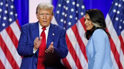 Trump and Gabbard during a town hall meeting in Wisconsin in August 

