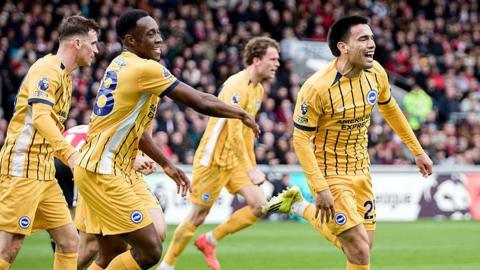 Diego Gomez and Danny Welbeck celebrate Gomez's goal for Brighton at Brentford in the Premier League