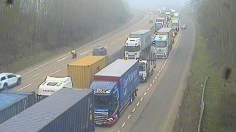 Traffic backed up on part of the A14. Vehicles can be seen nearly bumper to bumper on one of the carriageways.