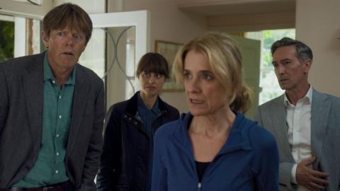 Beyond Paradise cast inside the house, looking baffled at something off camera