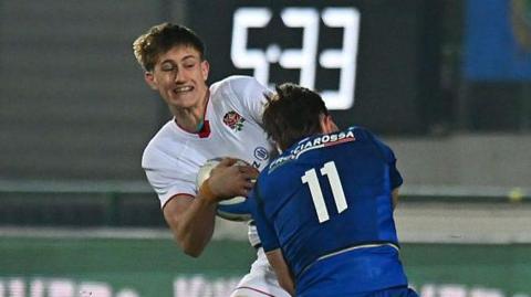 England and Italy compete for the ball
