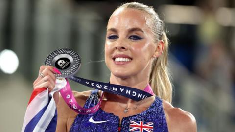 Keely Hodgkinson poses with her silver medal after the women's 800m final