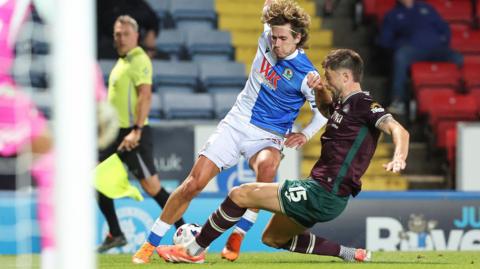 Todd Cantwell is tackled by Cameron Burgess