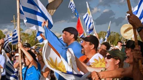 Farmers, traders and haulage contractors holding Uruguayan flags gathered to claim tax reliefs to President Tabare Vazquez's government in Durazno, Uruguay, on January 23, 2018