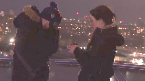 Sarah proposes to her boyfriend Daniel on top of the O2