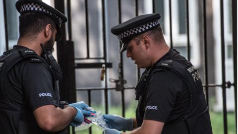 police seizing a knife