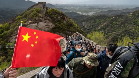 Visitors walk on the Great Wall during a visit to the popular tourist site on the first day of the May Labour Day holiday on April 29, 2023 in Beijing, China