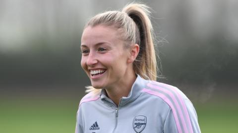 Leah Williamson smiling, wearing Arsenal training gear