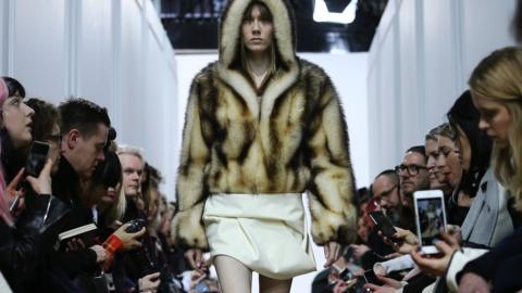 A model wearing a J W Anderson fur coat at London Fashion Week 2016