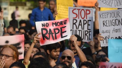 Indian demonstrators hold placards during a protest in support of rape victims following high profile cases in Jammu and Kashmir and Uttar Pradesh states