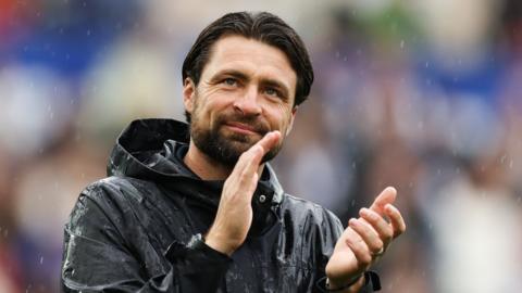 Russell Martin applauds the fans after Swansea's win over West Brom