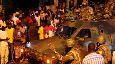 Senegalese troops secure area near state house in the Gambian capital Banjul Sunday Jan. 22, 2017