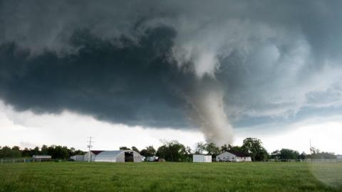 A tornado rips through a residential area after touching down south of Wynnewood, Oklahoma on May 9, 2016