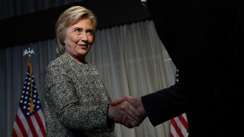 Hillary Clinton shaking hands