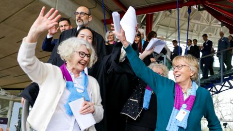 Activists of Climate Seniors from Switzerland celebrate as they leave the European Court of Human Rights (ECHR), after the judgement in a case against different European countries accused of climate inaction at the European court of Human Rights in Strasbourg, France, on 9 April 2024
