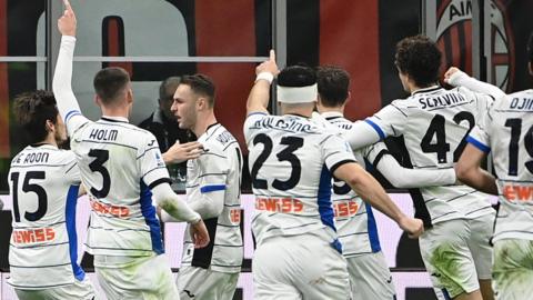 Atalanta players celebrate Teun Koopmeiners' goal against AC Milan in Serie A