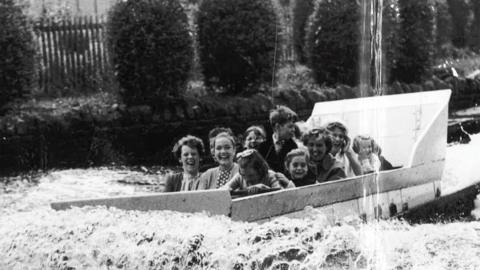 People on the water chute at Wicksteed Park