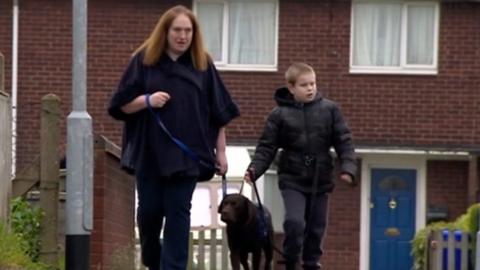 Lewis with his mother and Arthur the Labrador