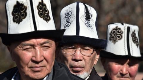 Kyrgyz men wear the national hat - the kalpak. File photo