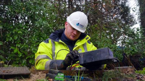 Water leak sensor being installed