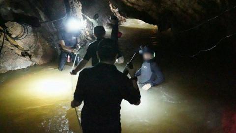 Rescuers inside the cave