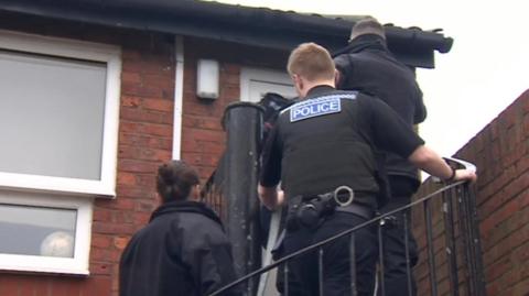Officers raid a property on Teesside