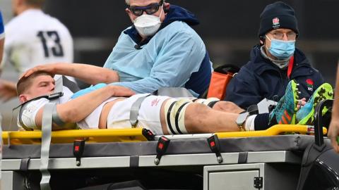 Jack Willis is injured during England's win over Italy