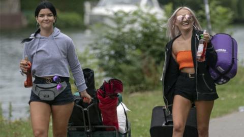 Two girls with camping gear