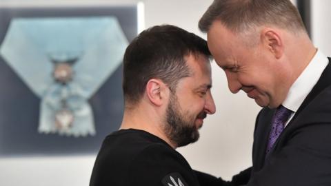 Polish President Andrzej Duda (R) awards Ukrainian President Volodymyr Zelensky with Order of the White Eagle during his visit in Warsaw, Poland, 05 April 2023.