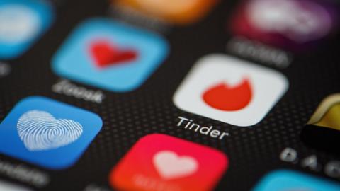 The 'Tinder' app logo is seen amongst other dating apps on a mobile phone screen on November 24, 2016 in London, England. F