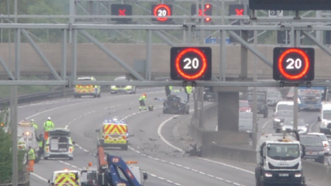 Emergency services at the scene of a crash on the M1 northbound by Luton in Bedfordshire