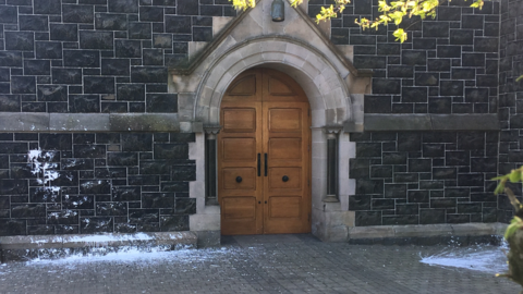 The front of Sacred Heart Church with paint marks