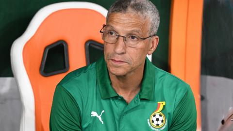 Ghana boss Chris Hughton sits in the dugout during the 2023 Africa Cup of Nations