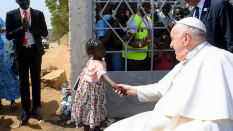 Pope Francis greets children during a meeting with bishops, priests, deacons, consecrated persons, seminarians and lay pastoral workers, of South Sudan, in the Cathedral of Saint Therese on February 04, 2023