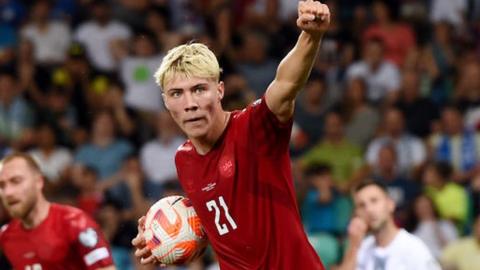 Rasmus Hojlund celebrates while playing for Denmark