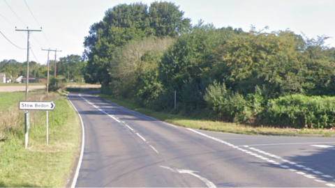 Road sign for Stow Bedon on the A1075.