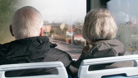 Old couple on bus