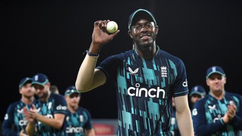 Jofra Archer walks off with the match ball after taking 6-40 against South Africa in the third ODI